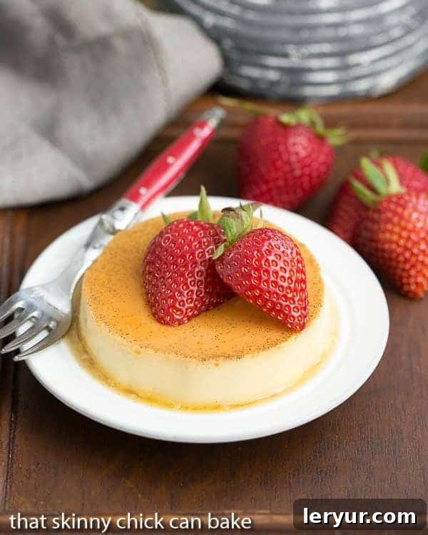 Mini vanilla Flans on a white dessert plate with a red handled fork, showcasing the perfect individual serving.