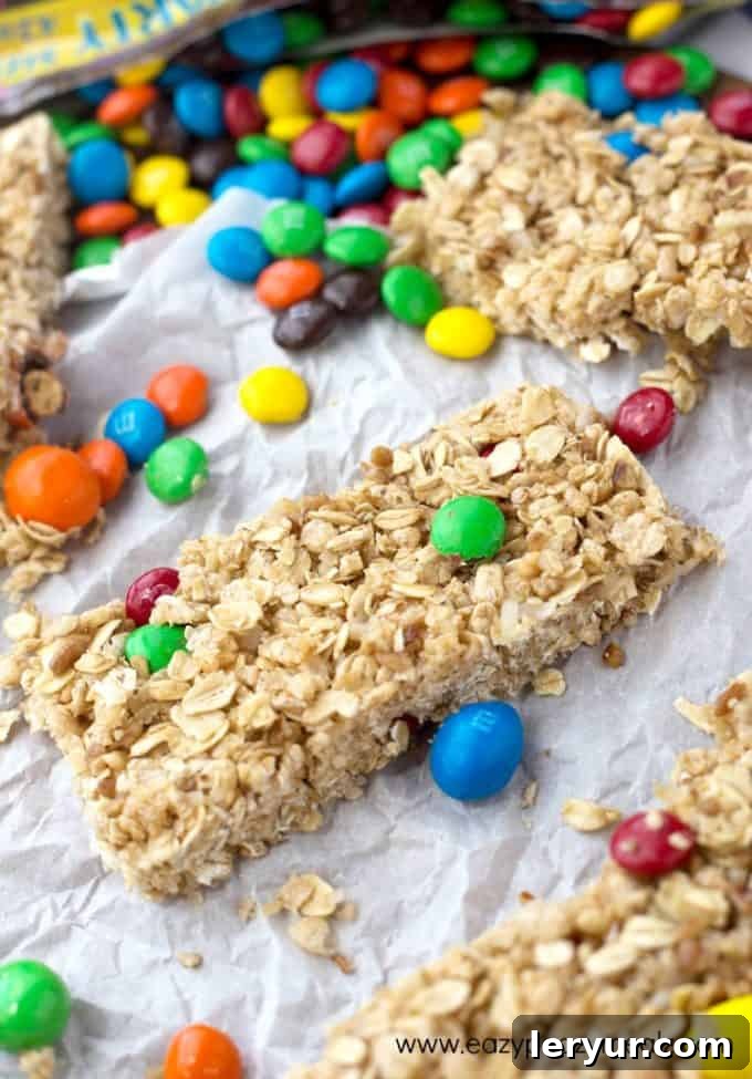 Colorful No Bake M&M’s Granola Bars, packed with oats and M&M's, ideal for a quick snack or treat.