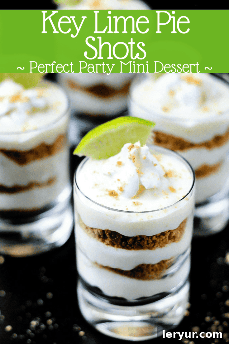 Mini Key Lime Pie Shots, elegantly layered in small dessert glasses with whipped cream and lime slices.