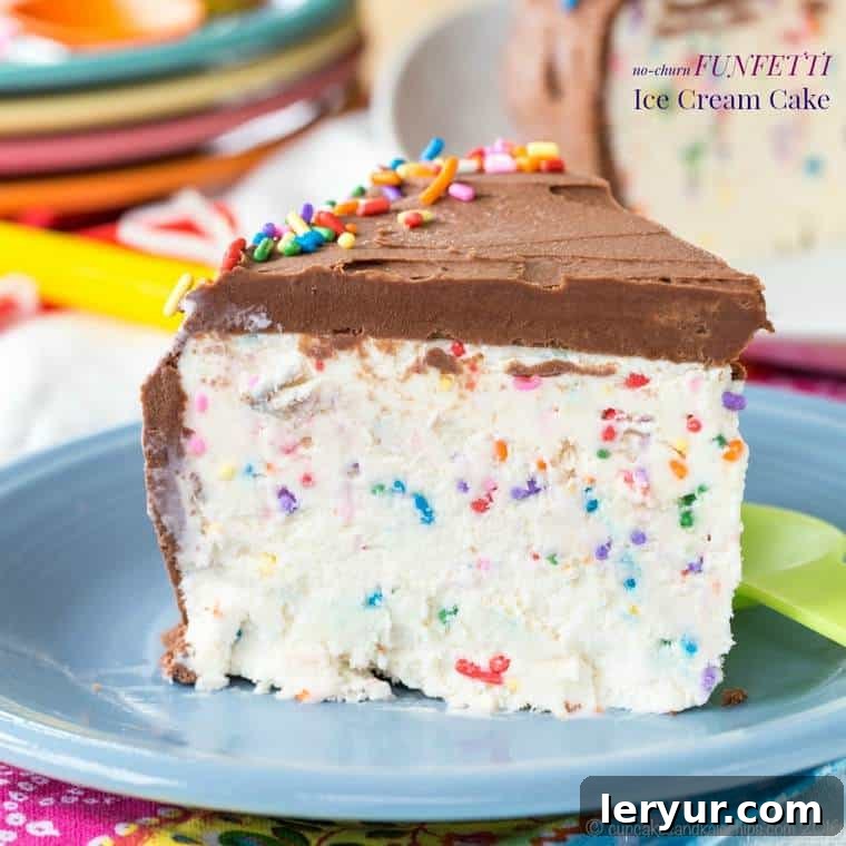 Vibrant No-Churn Funfetti Ice Cream Cake, generously decorated with colorful sprinkles, sliced and ready to serve.