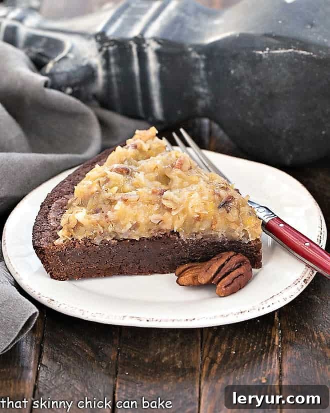German Chocolate Brownies: A decadent fudgy brownie topped with the classic coconut and pecan German chocolate frosting! Slice of German Chocolate Brownie Pie on a round white plate with a red handled fork