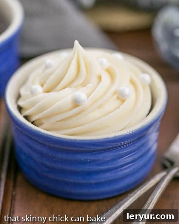 Vanilla Buttercream Topped Cocoa Cupcakes - Moist, scrumptious chocolate cupcake recipe topped with a mound of vanilla buttercream Vanilla Buttercream Topped Cocoa Cupcakes presented beautifully in blue ramekins
