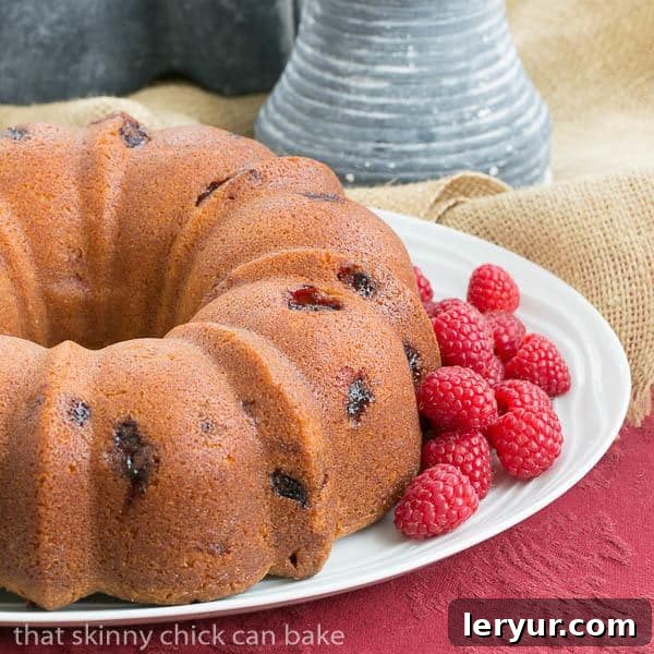 Berry Bliss: 50+ Irresistible Dessert Ideas 10 A beautiful Raspberry Amaretto Bundt Cake, glistening with a light glaze and studded with fresh raspberries.