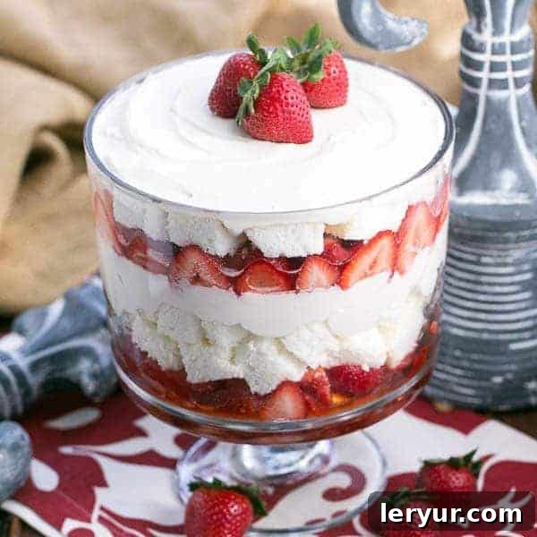 Berry Bliss: 50+ Irresistible Dessert Ideas 5 An impressive Strawberry Cheesecake Trifle showcasing layers of angel food cake, berries, and cream cheese.