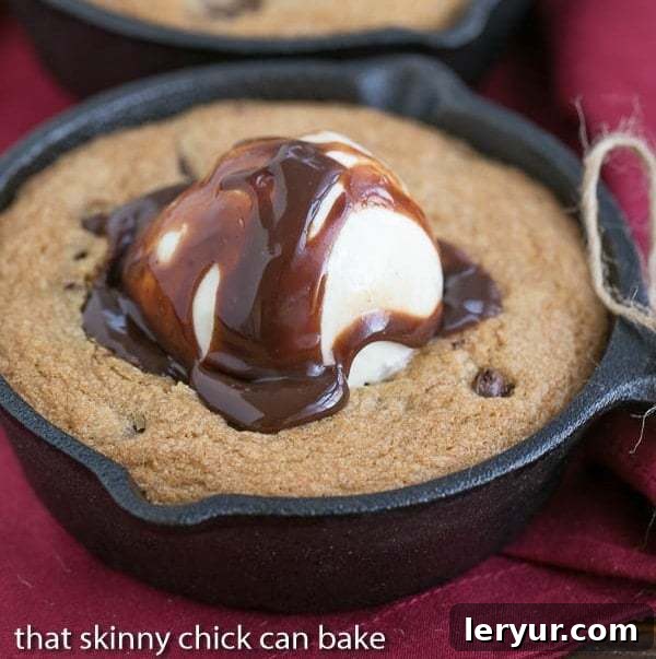 Skillet Chocolate Chip Cookie, a warm, gooey, oversized cookie served in a cast iron skillet with ice cream.