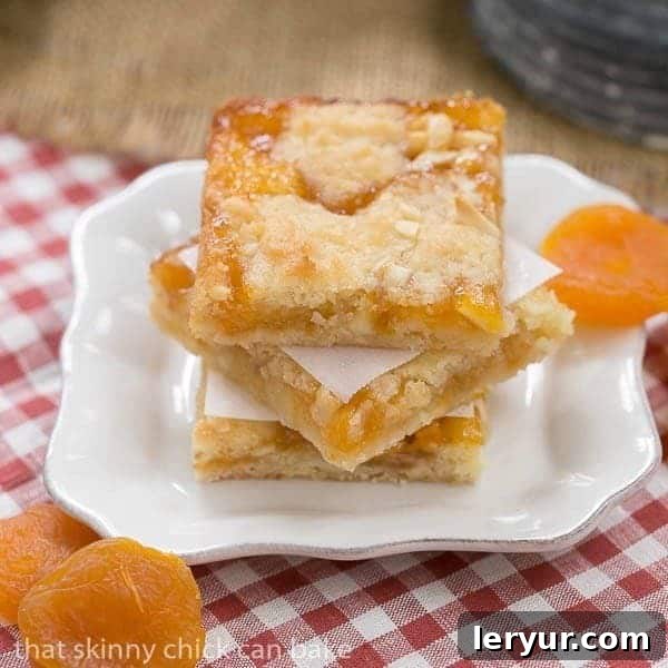Coconut Apricot Bars, golden bars with a crumbly topping and sweet apricot filling.