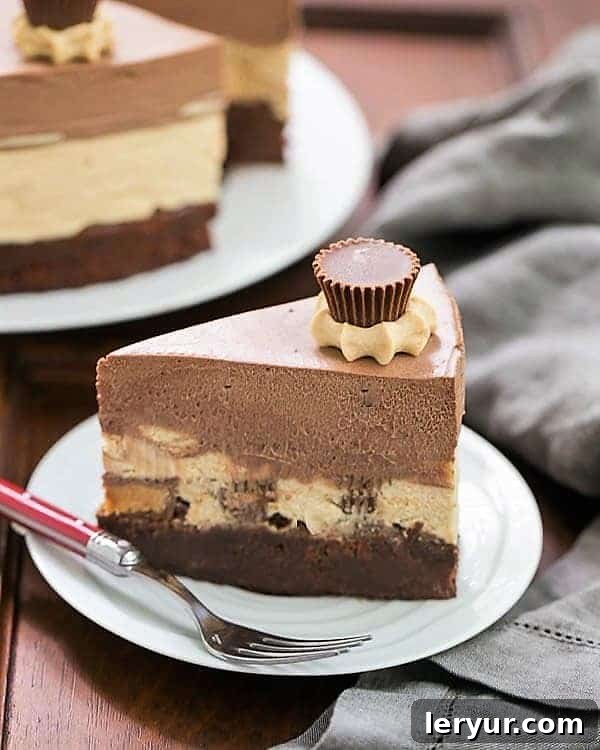 A delectable slice of Peanut Butter Chocolate Mousse Cake presented on a pristine white dessert plate, accompanied by a fork with a vibrant red handle. The layers of fudgy brownie, creamy peanut butter mousse, and silky chocolate mousse are clearly visible, promising an irresistible treat.