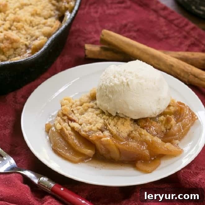 Grilled Apple Crisp, sweet and smoky, cooked in a cast iron skillet.