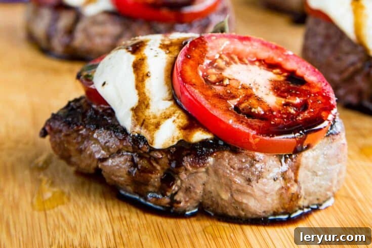 Grilled Filet Mignon with Caprese Fixings - mozzarella, tomato, and basil.
