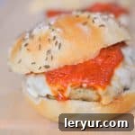 Chicken Parmesan Burger, topped with mozzarella and marinara sauce.