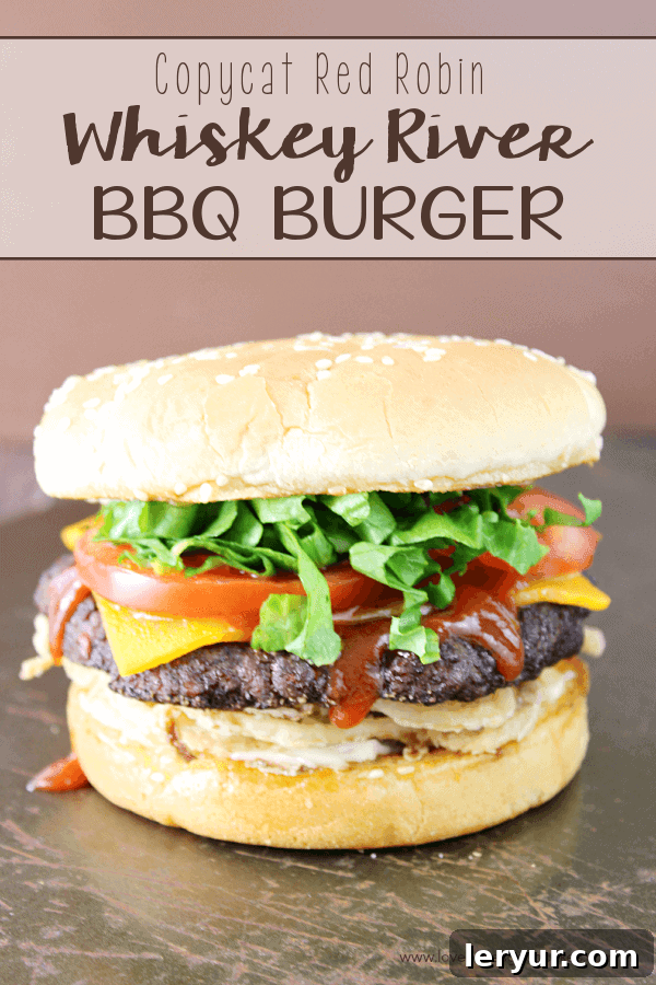 Copycat Red Robin Whiskey River BBQ Burger, topped with Bourbon Whiskey BBQ Sauce.