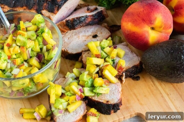 Grilled Pork Tenderloin with fresh Avocado Peach Salsa.