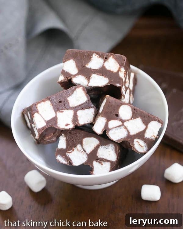 Dreamy Chocolate Marshmallow Fudge 2 Overhead view of a generous serving of Chocolate Marshmallow Fudge in a white bowl, showcasing its rich texture and marshmallow swirls.