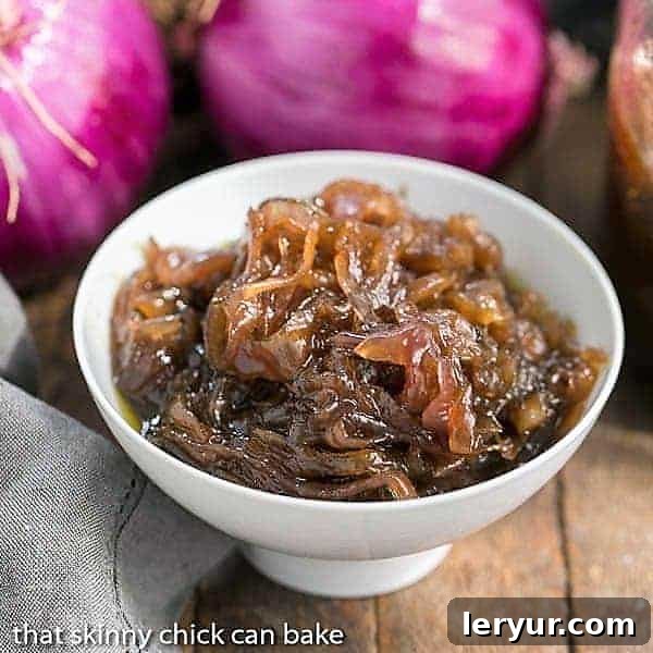 French Onion Marmalade - A French-inspired condiment, also celebrated as Confit d"Oignon, perfect for elevating your culinary creations! Delicious French Onion Marmalade in a white bowl, garnished with fresh red onions, highlighting its rich texture and color.