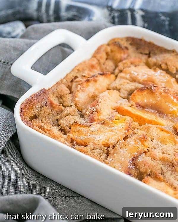 Fresh Peach Pudding partial view in a white ceramic casserole