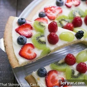 A beautifully arranged Fresh Fruit Pizza on a pan, ready to be served.