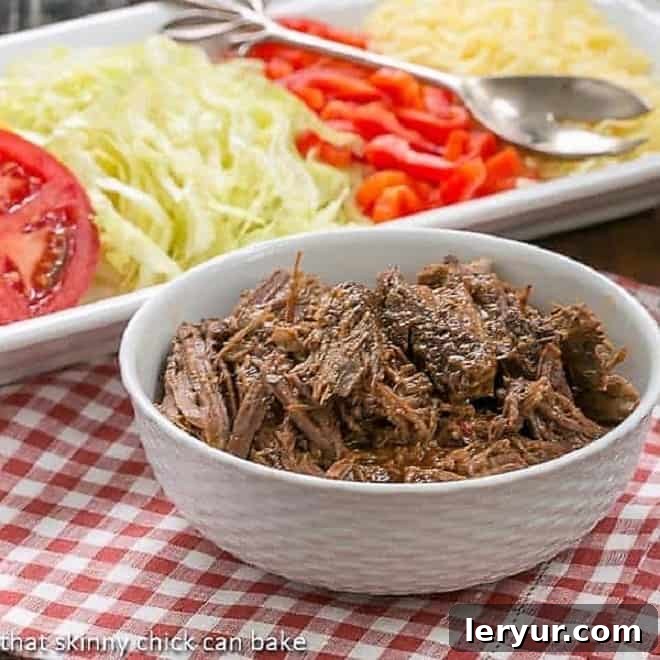 Shredded beef barbacoa, slow-cooked and seasoned with Mexican-inspired spices, perfect for tacos or bowls.