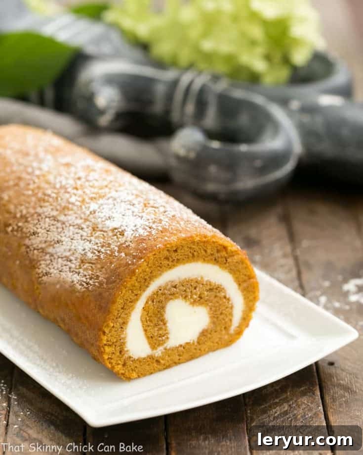A classic pumpkin roll with a creamy filling, beautifully sliced and ready to serve.