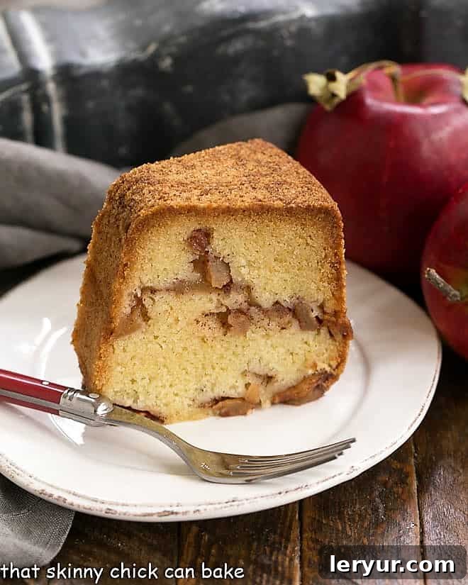 A beautiful apple bundt cake, topped with a sweet glaze, showcasing its intricate shape and golden crust.