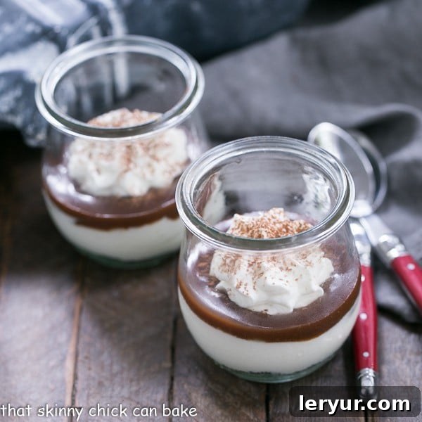 Midnight Graveyard Parfaits 4 Three elegantly presented Fudgy Tombstone Parfaits, arranged for a Halloween gathering, showcasing their intricate layers and spooky garnishes.