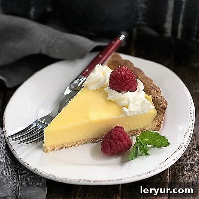 A vibrant and luscious Creamy Lemon Tart, bursting with intense lemon flavor, perfect for lemon lovers.