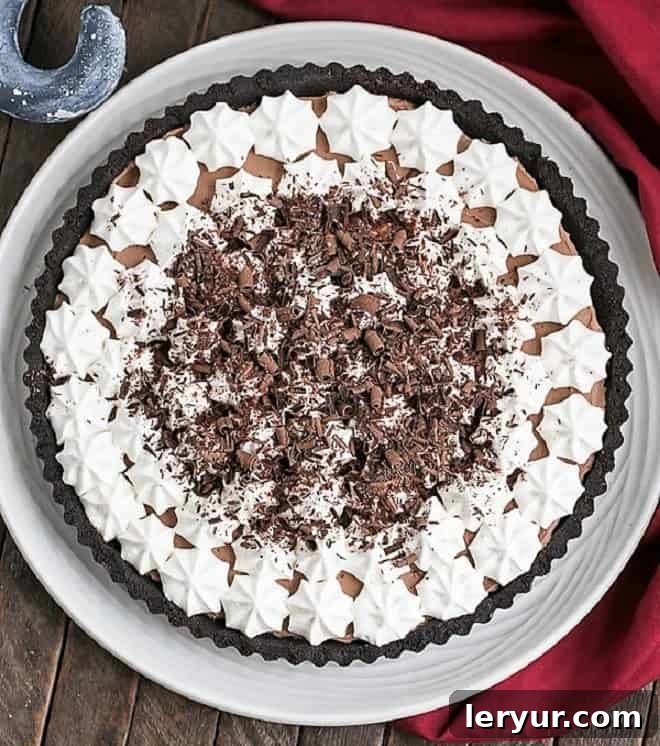 A decadent French Silk Tart with an Oreo crust, featuring the most luscious, silky, and rich chocolate filling.