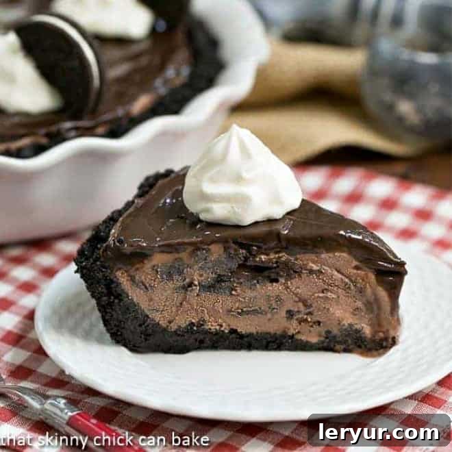 Easy Fudge Topped Chocolate Ice Cream Pie, made with a cookie crumb crust, chocolate ice cream, and fudge sauce, perfect for summer celebrations or year-round enjoyment.
