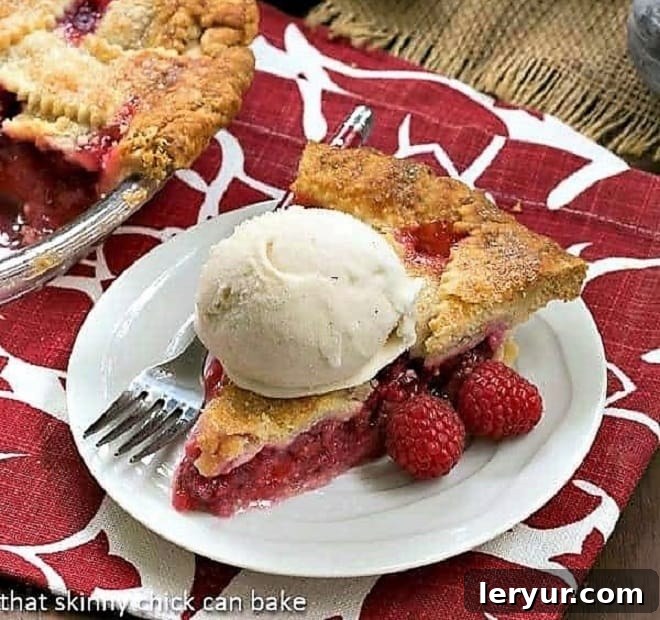 A beautiful Lattice Topped Raspberry Pie, an ideal summer dessert bursting with fresh raspberry flavor, perfect with vanilla ice cream.