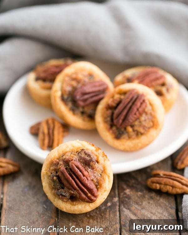Pecan Tassies | Mini Pecan Pies in cream cheese pastry crusts, beautifully garnished