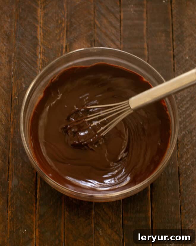 Irresistible Peanut Butter Truffle Brownies 11 Smooth, melted chocolate ganache in a bowl.