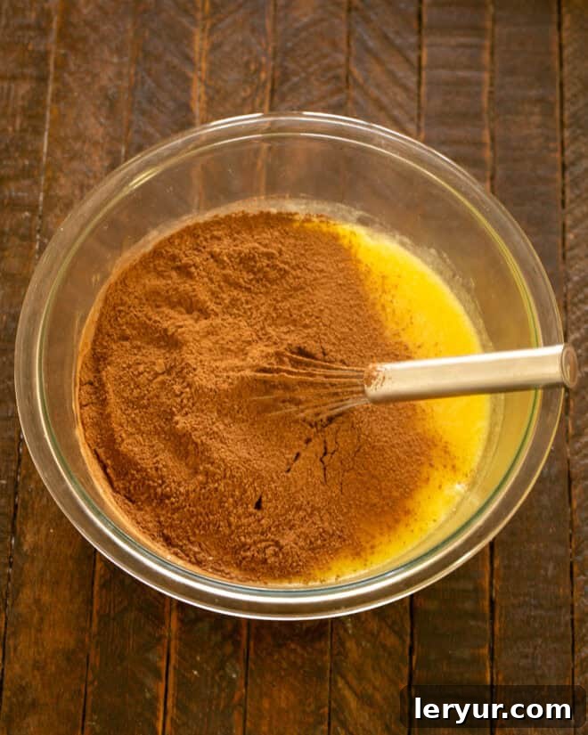 Irresistible Peanut Butter Truffle Brownies 5 Cocoa powder, salt, and baking powder sifted into the wet ingredients.