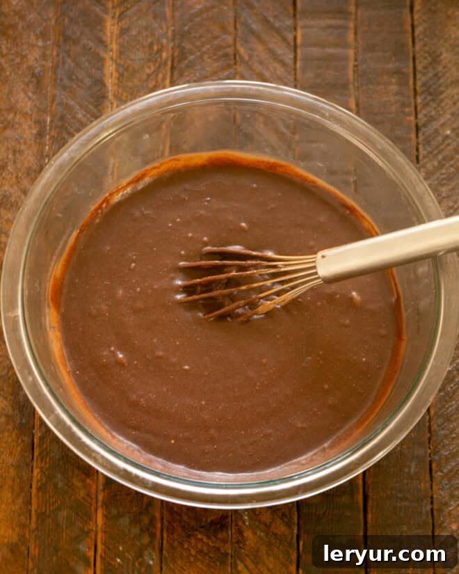Irresistible Peanut Butter Truffle Brownies 6 Brownie batter being mixed thoroughly.