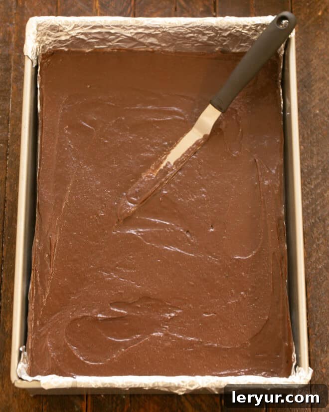 Irresistible Peanut Butter Truffle Brownies 8 Brownie batter spread evenly in the prepared baking pan.