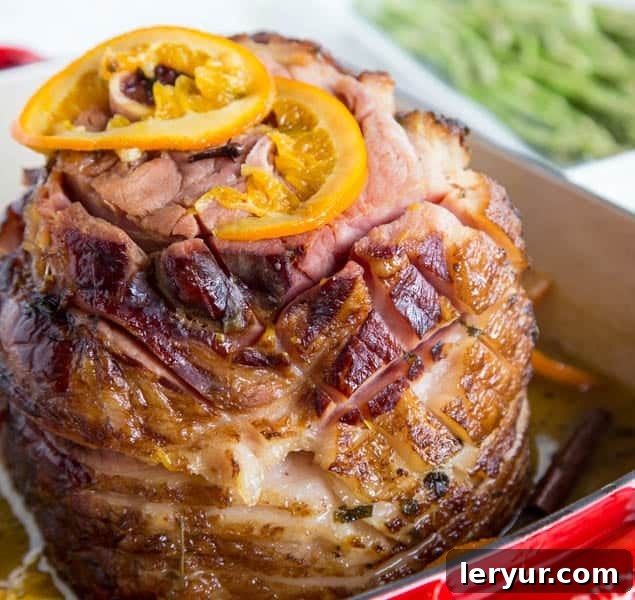 A perfectly baked ham with a glistening tangerine glaze.
