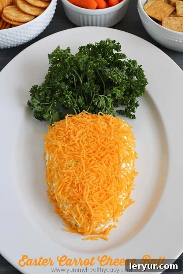 An adorable carrot-shaped cheese ball appetizer.