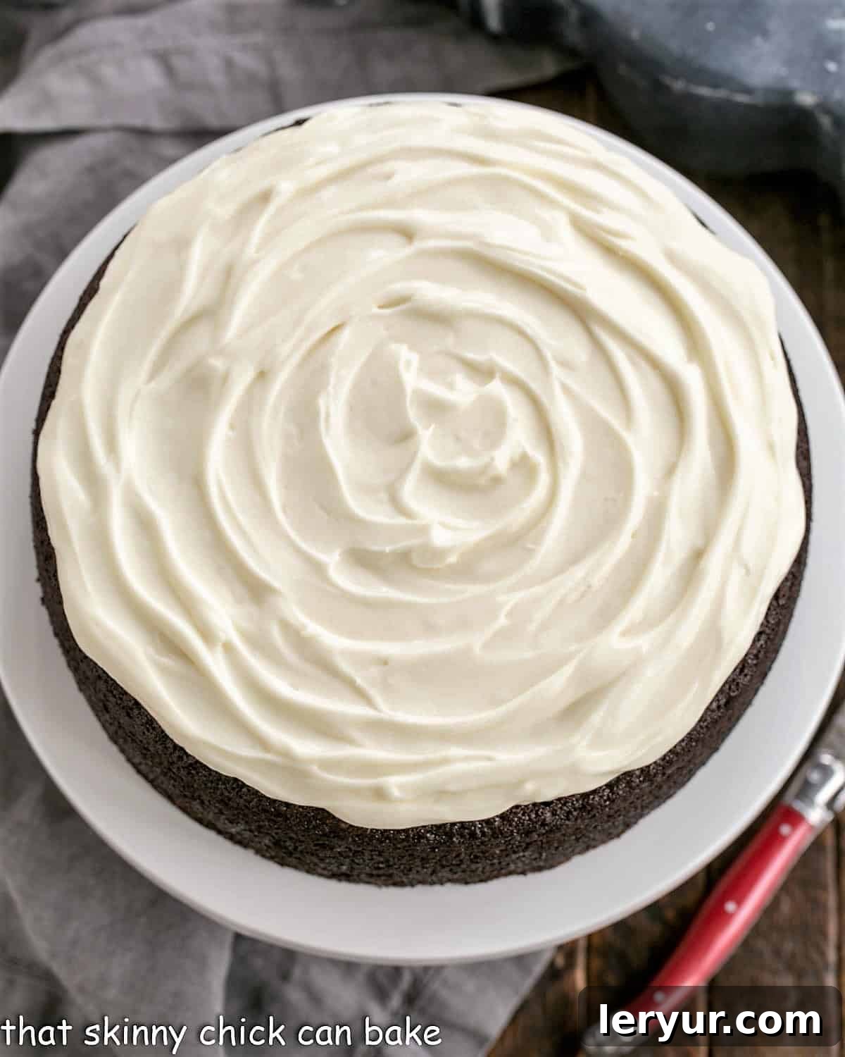 Close-up overhead shot of Chocolate Guinness Cake with a swirl of cream cheese frosting.