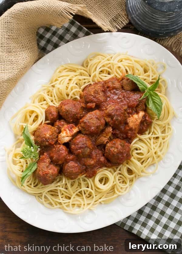 Close-up of slow-simmered Sunday Gravy with various meats