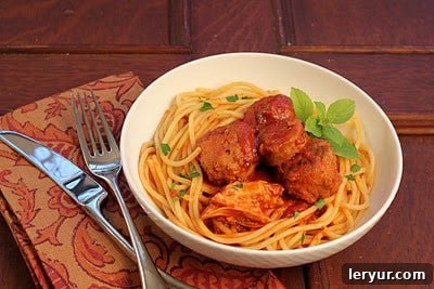 Sunday Gravy Spaghetti 4 A hearty bowl of homemade meatballs and spaghetti drenched in rich Sunday Gravy