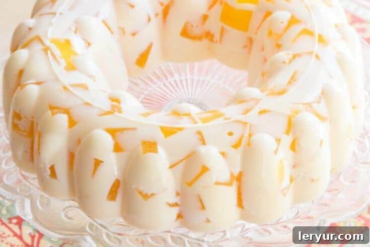 Classic Orange Creamsicle Jello Mold Salad, a cool and easy holiday side or dessert.