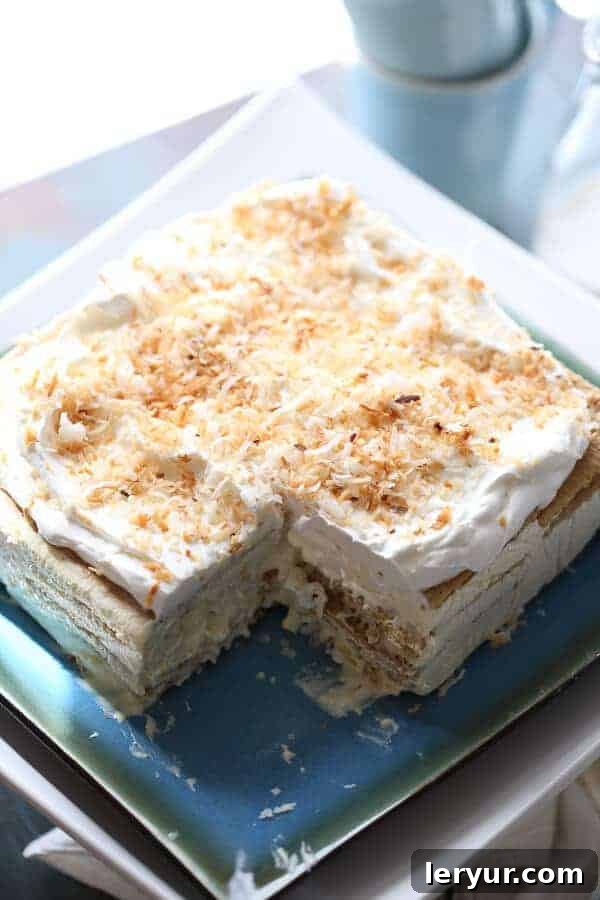 Vanilla Coconut Ice Box Cake with creamy layers and graham crackers.