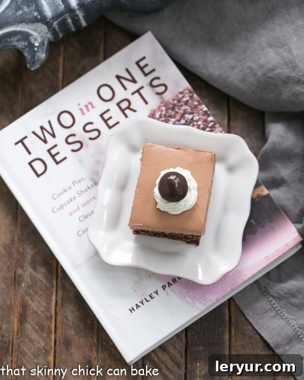 French Silk Pie Brownies - A spectacular 2-in-1 dessert that's a cinch to prepare! A serving of French Silk Pie Brownies resting beside the 'Two in One Desserts' cookbook, highlighting the recipe's origin.