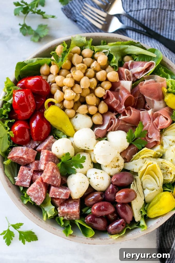 Antipasto Salad, a colorful side dish featuring classic antipasto ingredients like cured meats, cheeses, and marinated vegetables.