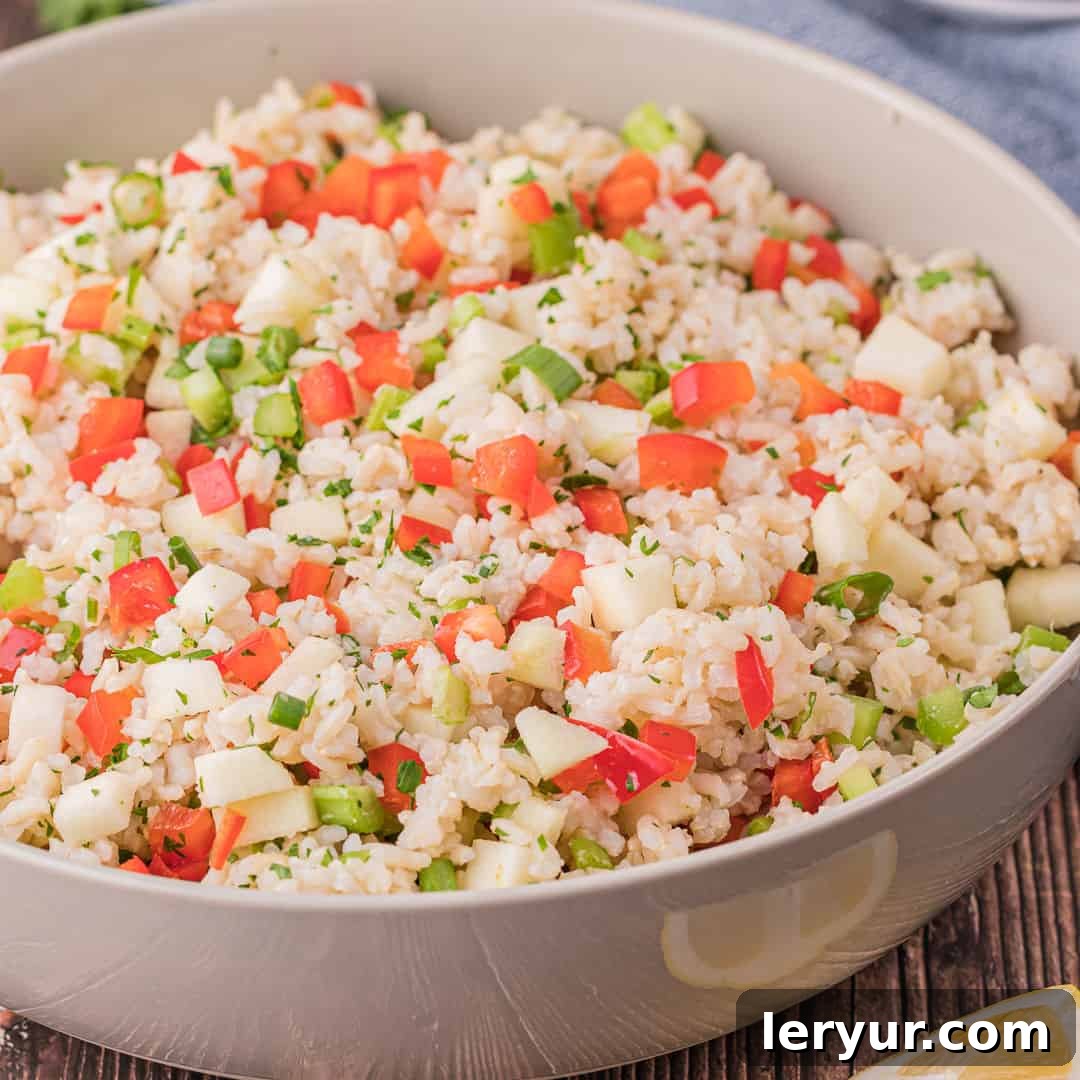 Apple & Brown Rice Salad, a crunchy and wholesome salad with fresh fruit, vegetables, and brown rice.