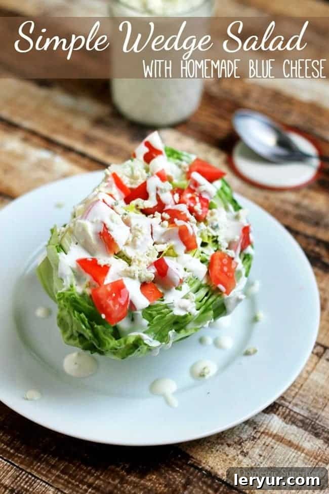 The BEST Simple Wedge Salad, with a crisp iceberg lettuce wedge, bacon, tomatoes, and homemade blue cheese dressing.