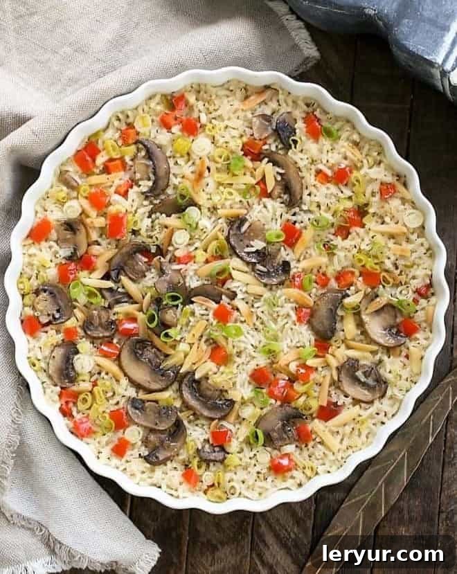 Overhead view of baked rice pilaf in a round dish, perfectly cooked and ready to serve.