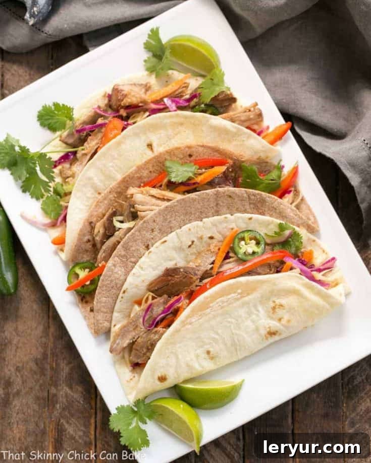Slow Cooker Asian Pork Tacos with Cabbage Slaw | Shredded pork tacos with an Asian twist!