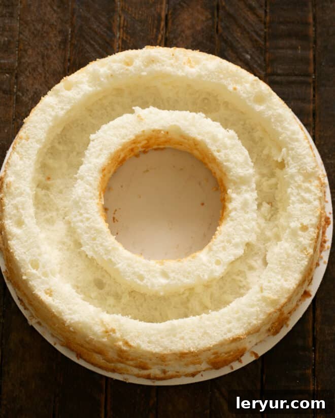 An angel food cake with a trench carved out of the center, creating space for the mousse filling.