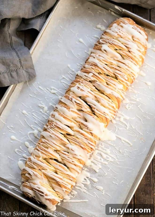 Braided Cinnamon Bread Recipe with Laminated Dough - An exquisite breakfast treat Braided Cinnamon Danish with Laminated Dough on a parchment lined baking sheet, ready for the oven.