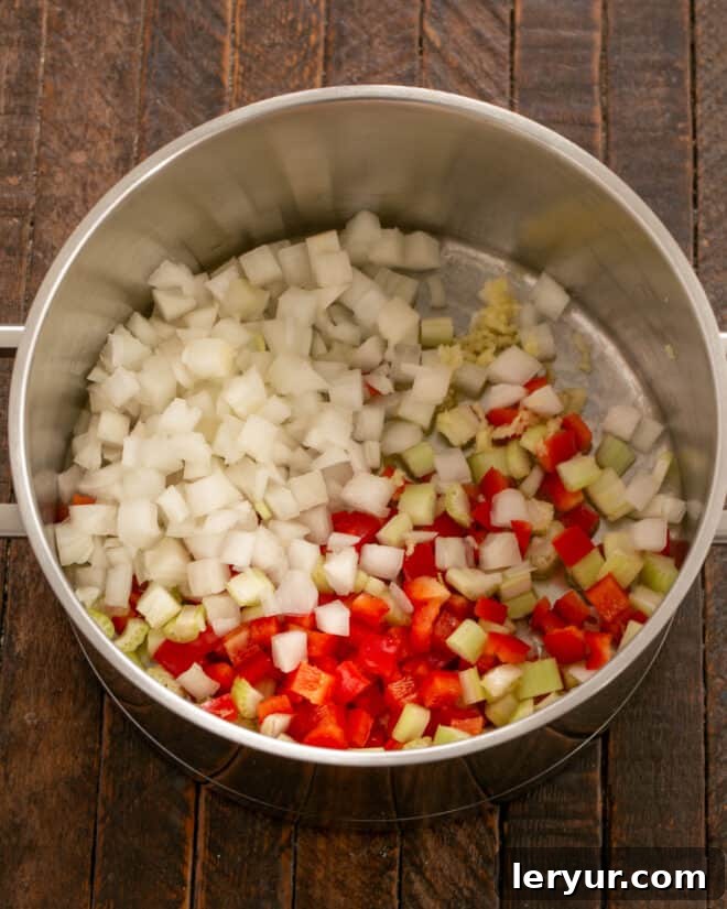 Sautéing onions and vegetables in olive oil for chili.