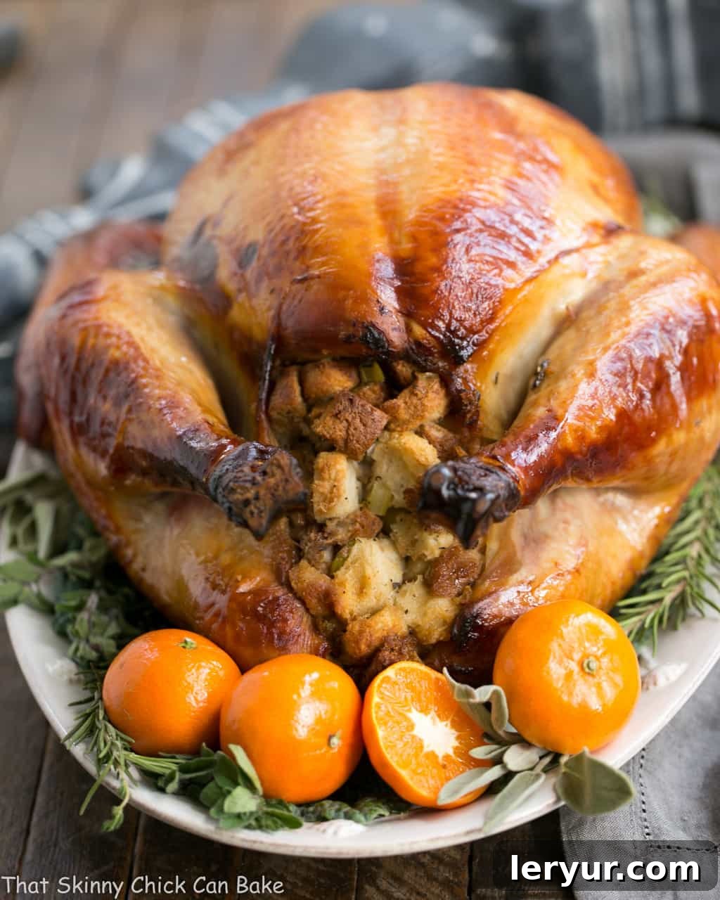 Honey Brined Turkey Recipe - Achieve Succulent Holiday Turkey Every Time A close-up view of a Honey Brined Turkey, showing the perfectly roasted, golden-brown skin and a hint of flavorful stuffing, garnished with fresh herbs and orange slices.